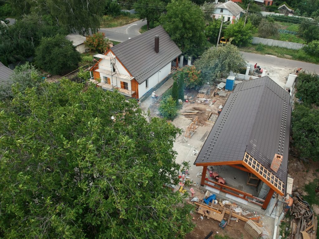 New private housing development construction in rural countryside aerial view